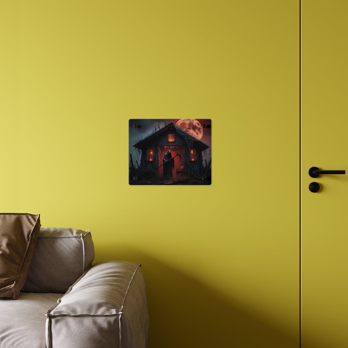 Halloween-themed wall decal of a haunted house on a yellow wall above a sofa.