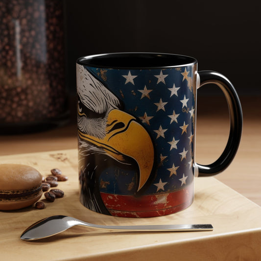 Mug with eagle design on a wooden coaster with coffee beans and a spoon